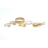 Two 9ct gold rings, a pair of gold earrings, a half gem set 18ct gold ring, a 9ct wedding band and