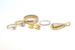 Two 9ct gold rings, a pair of gold earrings, a half gem set 18ct gold ring, a 9ct wedding band and