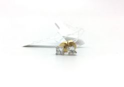 Pair of princess cut diamond stud earrings, estimated total diamond weight diamond 0.28ct, in yellow