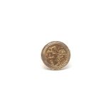 A 9ct gold ring set with a half sovereign. Approximately 7.76g