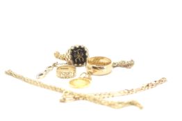 A 9ct gold Band, a 9ct stone set signet ring and another 9ct band. Three 9ct necklaces with two