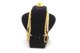 A 22ct yellow Gold Ring And Chain. Approximately 37.50g.