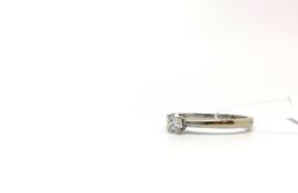 Single stone diamond ring, brilliant cut diamond claw set, princess cut diamond shoulders, estimated