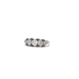 An Art Deco sapphire and diamond platinum ring. The five old cut/ transitional diamonds total