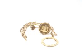 A 14ct Trinidad And Tobago Dollar with yellow gold mount and necklace as well as a 9ct gold ring.