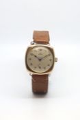 Vintage gold cased Rolex trench watch, circular dial with black Arabic numerals, subsidiary seconds,