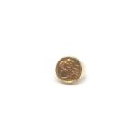 A 9ct gold ring set with a half sovereign. Total weight is approximately 12.52g.