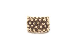 A large 9ct gold keeper Ring weighing approximately 28.3g