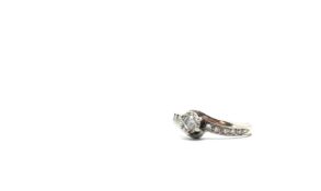 Single stone diamond ring, brilliant cut diamond claw set, diamond set shoulders, estimated