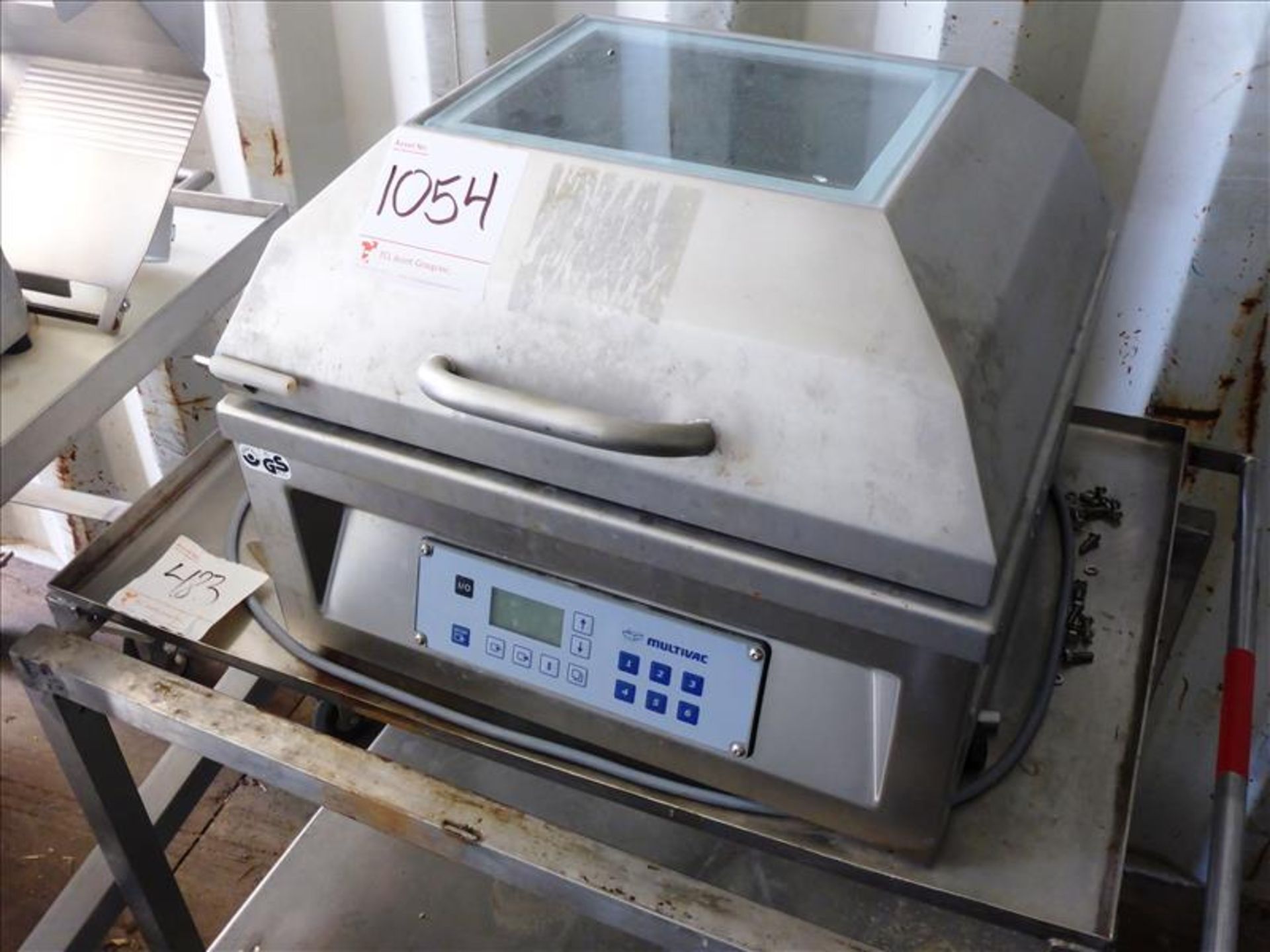 Multivac model C200, s/s vacuum packer, ser. no. 154034 (2011) c/w cart on casters (Tag No. 1054)