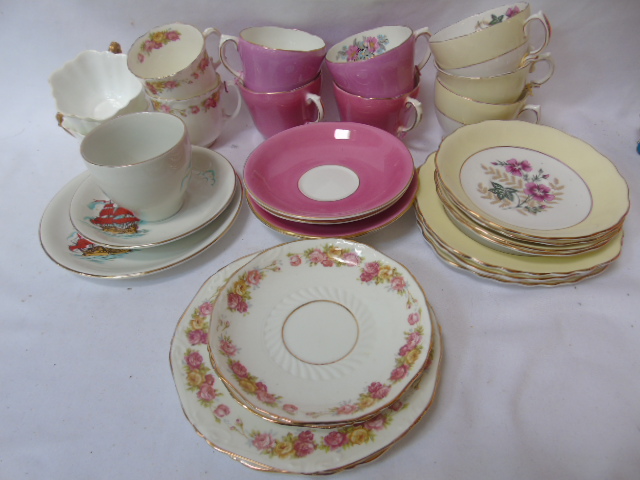 Collection of named china cups and saucers