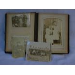 Antique fabric bound photo album together with vintage photographs