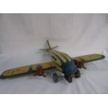 Vintage clockwork tin plate airplane