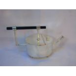 Modern round silver plated tea pot in Christopher Dresser style