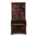 A George III mahogany secretaire bookcase, possibly attributable to Thomas Chippendale.