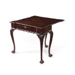 A late George II carved mahogany tea table.