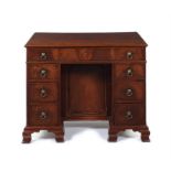 A George III mahogany kneehole bureau dressing table, attributed to Thomas Chippendale.