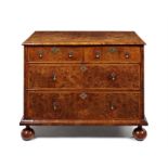 A George I burr walnut, crossbanded and featherbanded chest.