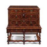 A William and Mary walnut, sycamore, oyster veneered and marquetry chest on stand.