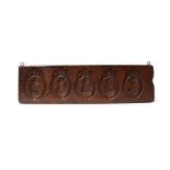 An interesting George III carved elm treen gingerbread mould/board.