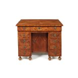 A Louis XIV kingwood crossbanded and parquetry kneehole desk.