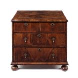 A small William and Mary walnut crossbanded and featherbanded chest.