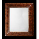 A large William & Mary olive oyster veneered mirror.