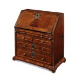 Miniature Furniture: A George II walnut bureau.
