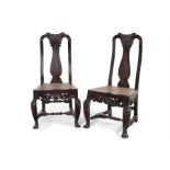 A pair of early 18th century Batavian (Indonesian) lacquered teak carved side chairs.