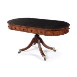 A Regency mahogany oval drum top library table.