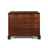 A George III 'plum pudding' mahogany and ebony banded chest, possibly attributable to Thomas