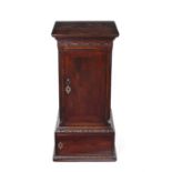 A George III carved mahogany dining room pedestal cupboard.