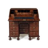 A William & Mary stained field maple, rosewood banded and pewter line inlaid bureau attributed to