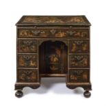 A George I green japanned kneehole desk, in the manner of John Belchier.