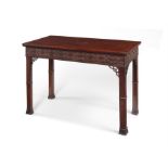 A George III mahogany serving table,  in the Chippendale style.