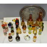 A group of alcoholic miniatures, including three Wade Bells Whiskey bottles of graduated size,