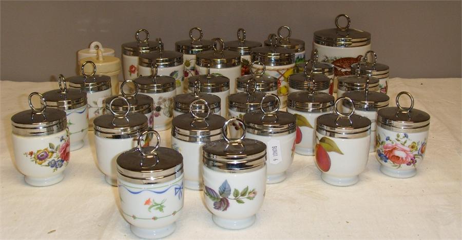 A collection of Royal Worcester egg coddlers in various patterns and sizes. (31)