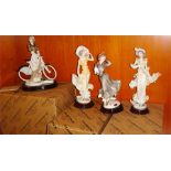 A quantity of Florence Giuseppe Armani figurines: Sun Shower 0656C, Winter Fun 0320C, Figurine of