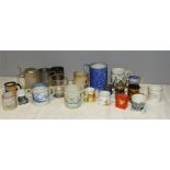 A group of early stoneglazed mugs and loving cups including a twin handled glass loving mug, a