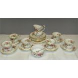 A Royal Albert Bone China 'Moss Rose' pattern part tea service comprising; a sandwich plate, seven