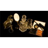 A silver bangle, Birmingham, a silver plated boxed set of knives, an ebony dressing table set, a cut