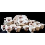 A Fine Bone China Crown Staffordshire part tea service comprising: twelve cups and saucers, milk