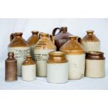 A group of stoneware jars, to include Harry Holgate Botanical Brewer, Leeds, bearing inscription '