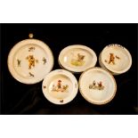 A group of children's bowls: a Czechoslovakian bowl depicting a girl pushing a teddy bear in a