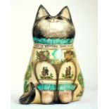 A Joan and David De Bethel decoupage cat, dated 1983, modelled seated with inscription to collar 'An