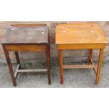 Two children's desks with sloped lids.