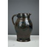 A stoneglazed jar with blue slip decoration, a mot