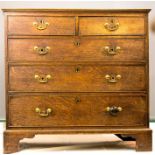 A Georgian mahogany chest of drawers, with two short over three long graduated drawers, raised on