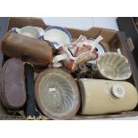A miscellaneous group to include stoneware jelly moulds, blue and white, a hot water bottle etc.