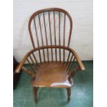 An elm 19th century Windsor armchair with hoop and